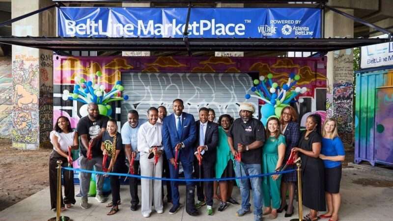 Atlanta BeltLine Inc. CEO Clyde Higgs, Atlanta Mayor Andre Dickens, Village Market's Lakeysha Hallmon ,and the representatives of the selected businesses for the pilot program.