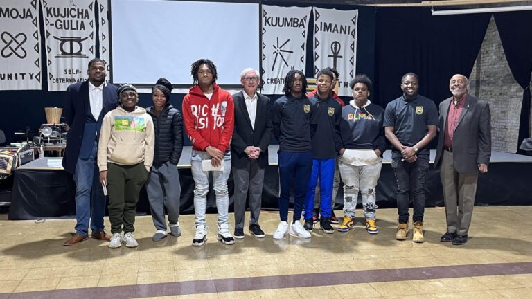 Governor-Tony-Evers-Clayborn-Benson-BLMA | Carvd N Stone Wisconsin Governor Tony Evers and Wisconsin Historical Society Museum Founder Clayborn Benson with students in Milwaukee.