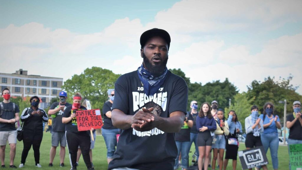 Khalil Coleman hypes up protestors as The Peoples’ Revolution marches for change. (Picture by Nick Hansen, Art saves Lives MKE)