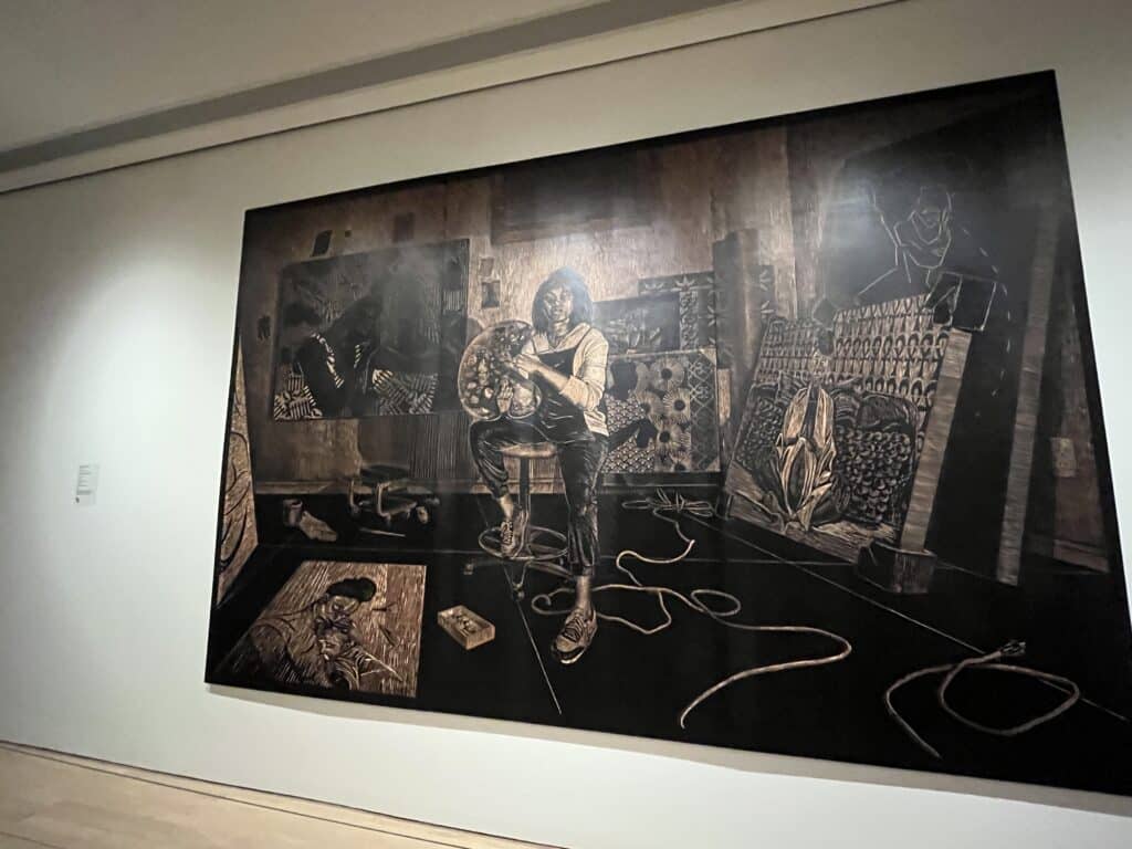 the eight-by-twelve wood carvings depict the daily life of Hobbs's family with themes of representation showcased throughout the work. (Picture by Maria Peralta-Arellano/ Carvd N Stone)