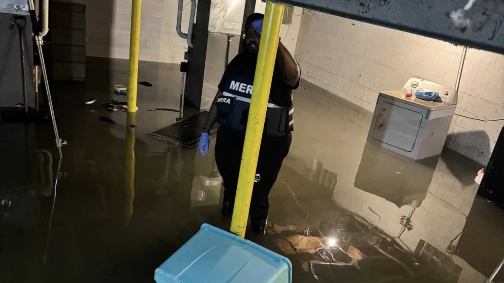 Montréal Cain and other community members after historic Milwaukee floods.